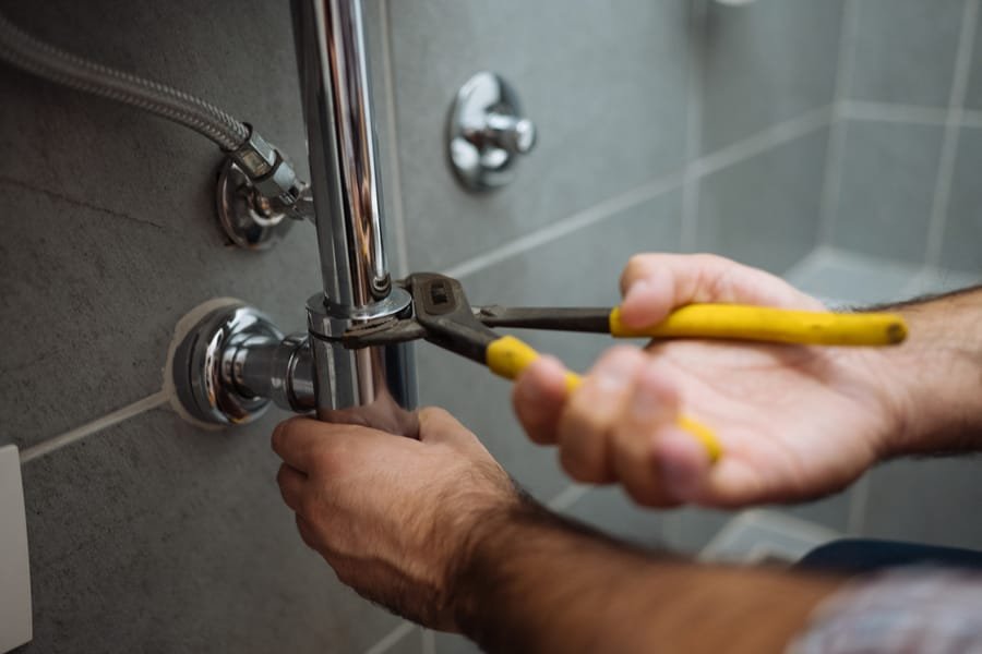 Electrician troubleshooting a home electrical issue in Albuquerque